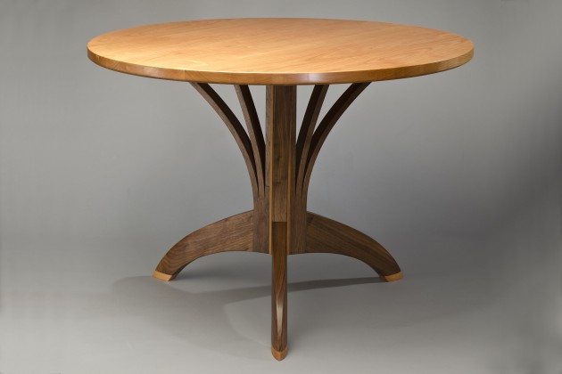 Round cafe table, round dining table with carved solid wood, walnut, cherry hand crafted by Seth Rolland furniture maker