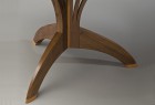 Detail of Arbol cafe table base in carved walnut and cherry by Seth Rolland custom furniture design