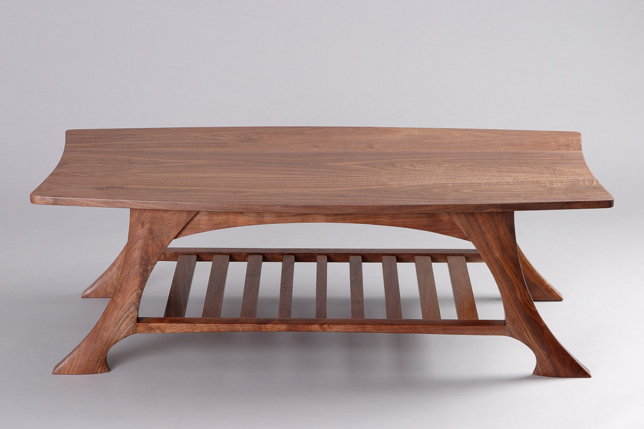 Coffee table with walnut shelf and carved legs custom made by Seth Rolland fine furniture design