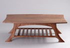 Coffee table with walnut shelf and carved legs custom made by Seth Rolland fine furniture design