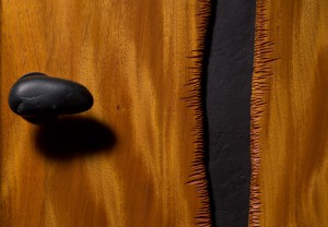 Custom carved mahogany door with slate and stone by Seth Rolland woodworks