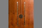 Custom sapele wood double entry doors with glass windows and bronze hardware