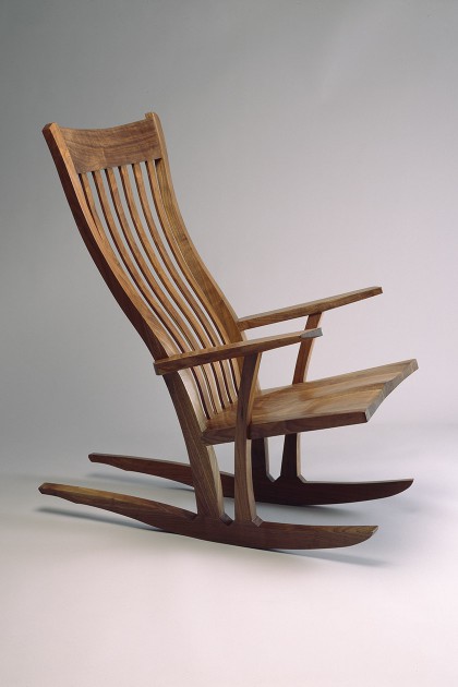 comfortable walnut wood rocking chair with flexible back slats hand carved and fitted by Seth Rolland custom furniture