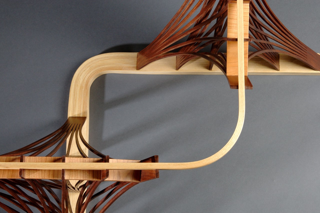 Detail of Parabola side table by Seth Rolland custom furniture, showing steam bent and laminated elements