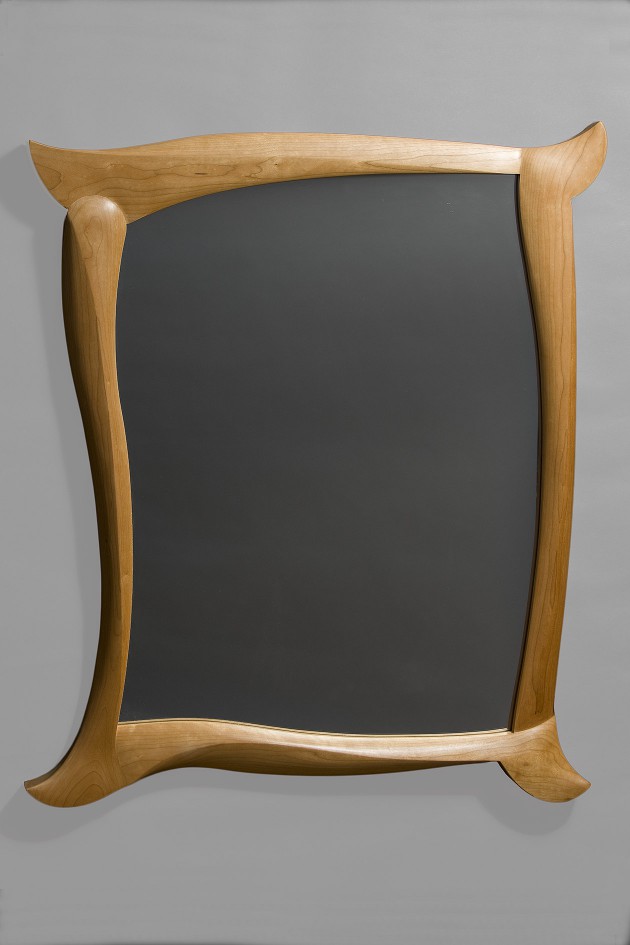 Cherry wood mirror with carved frame by Seth Rolland custom furniture design