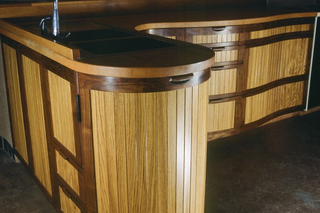 Curved kitchen cabinets in oak and walnut by Seth Rolland custom furniture design
