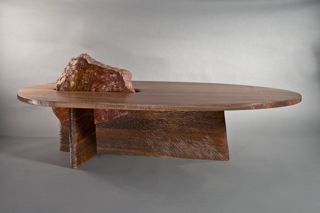 Carved wood and polished stone combine for an organic contemporary coffee table
