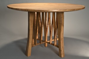 Live edged round cafe table for 4 made from solid wood with a natural edge by Seth Rolland furniture