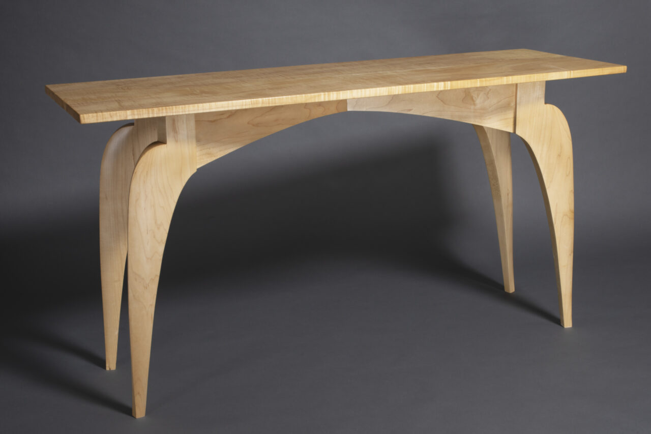 solid maple hall table with figured top and sculpted legs by Seth Rolland Custom Furniture