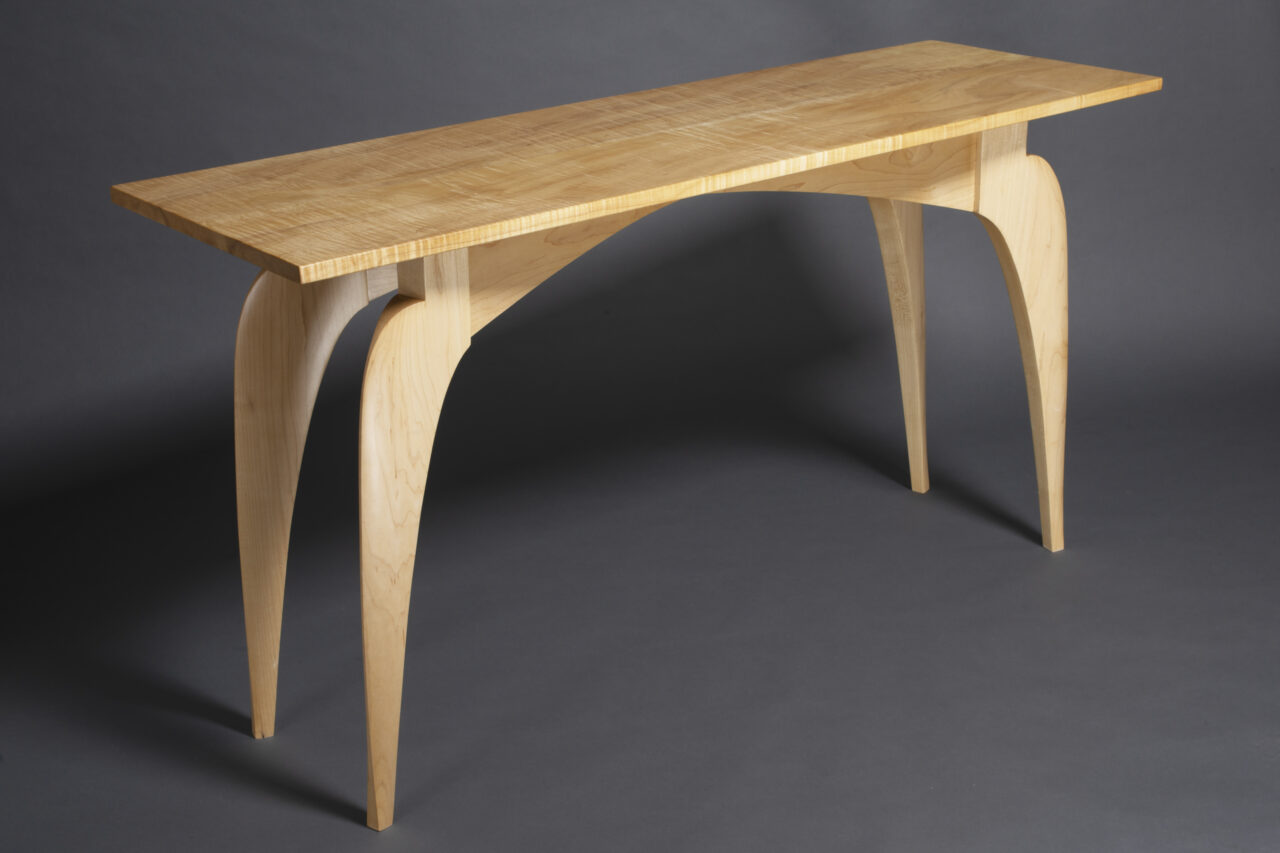 solid maple hall table with figured top and sculpted legs by Seth Rolland Custom Furniture