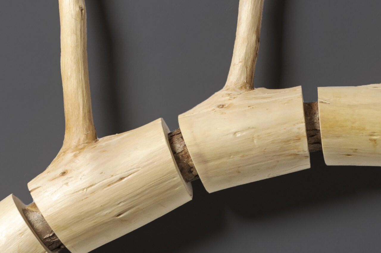 detail of cedar wall sculpture by Seth Rolland