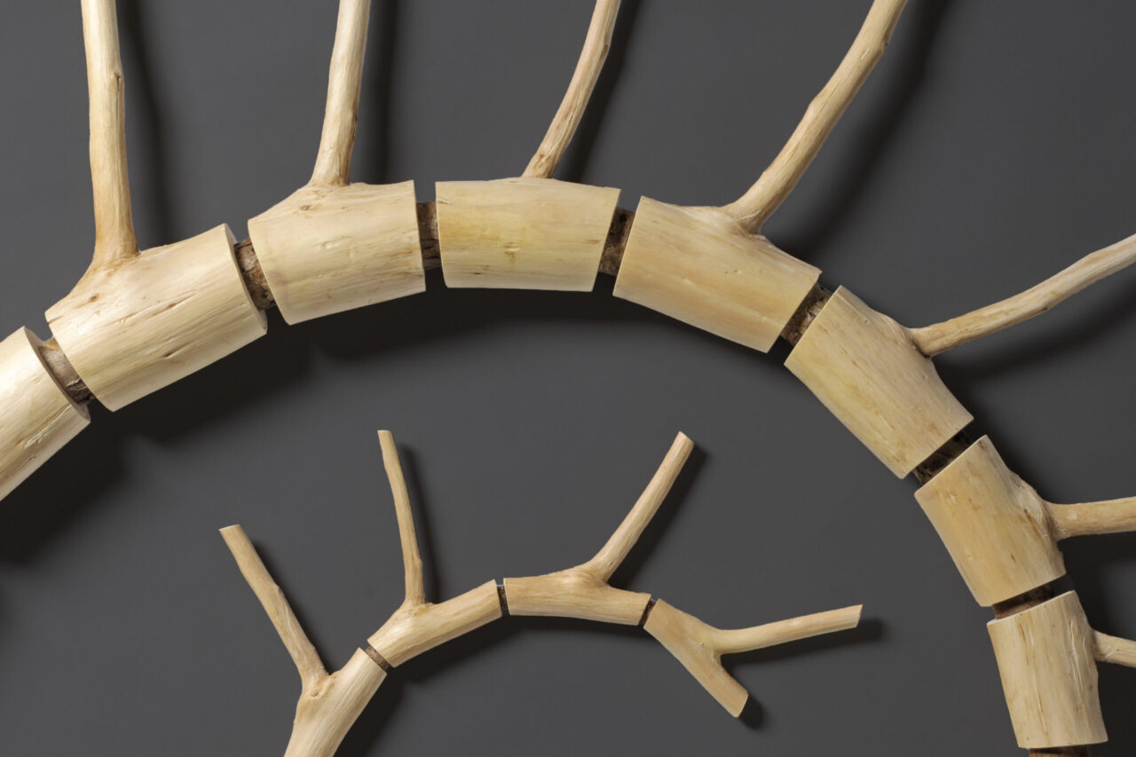 detail of cedar wall sculpture by Seth Rolland