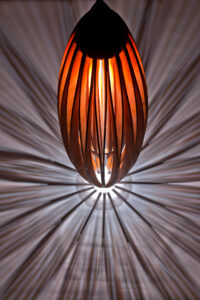 Tulip cherry wood hanging pendant lamp with shadows by Seth Rolland